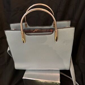 Elegant Light blue, with silver handles, and shoulder strap